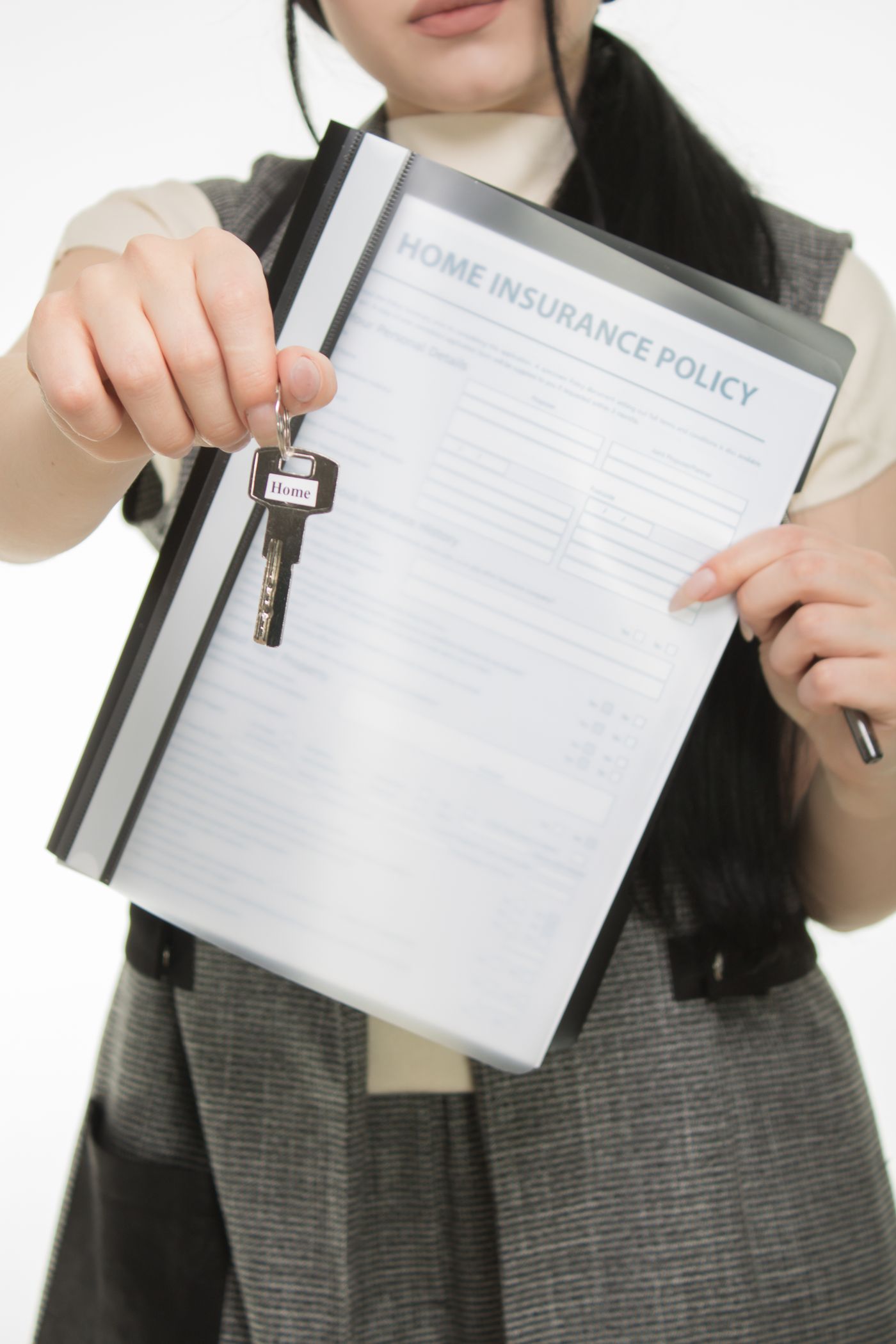 Home insurance documents and a property key
